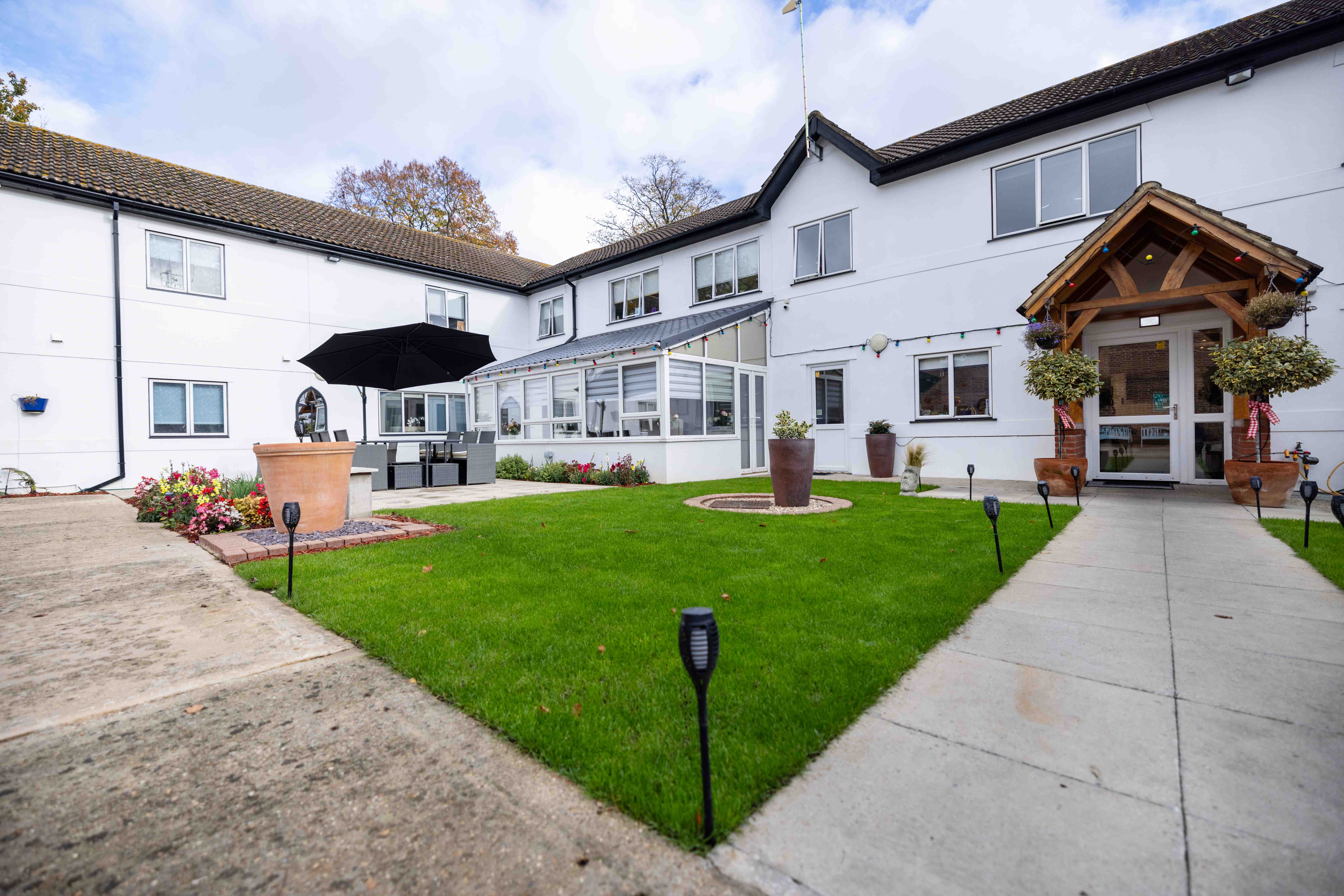 Courtyard with lawn and conservatory