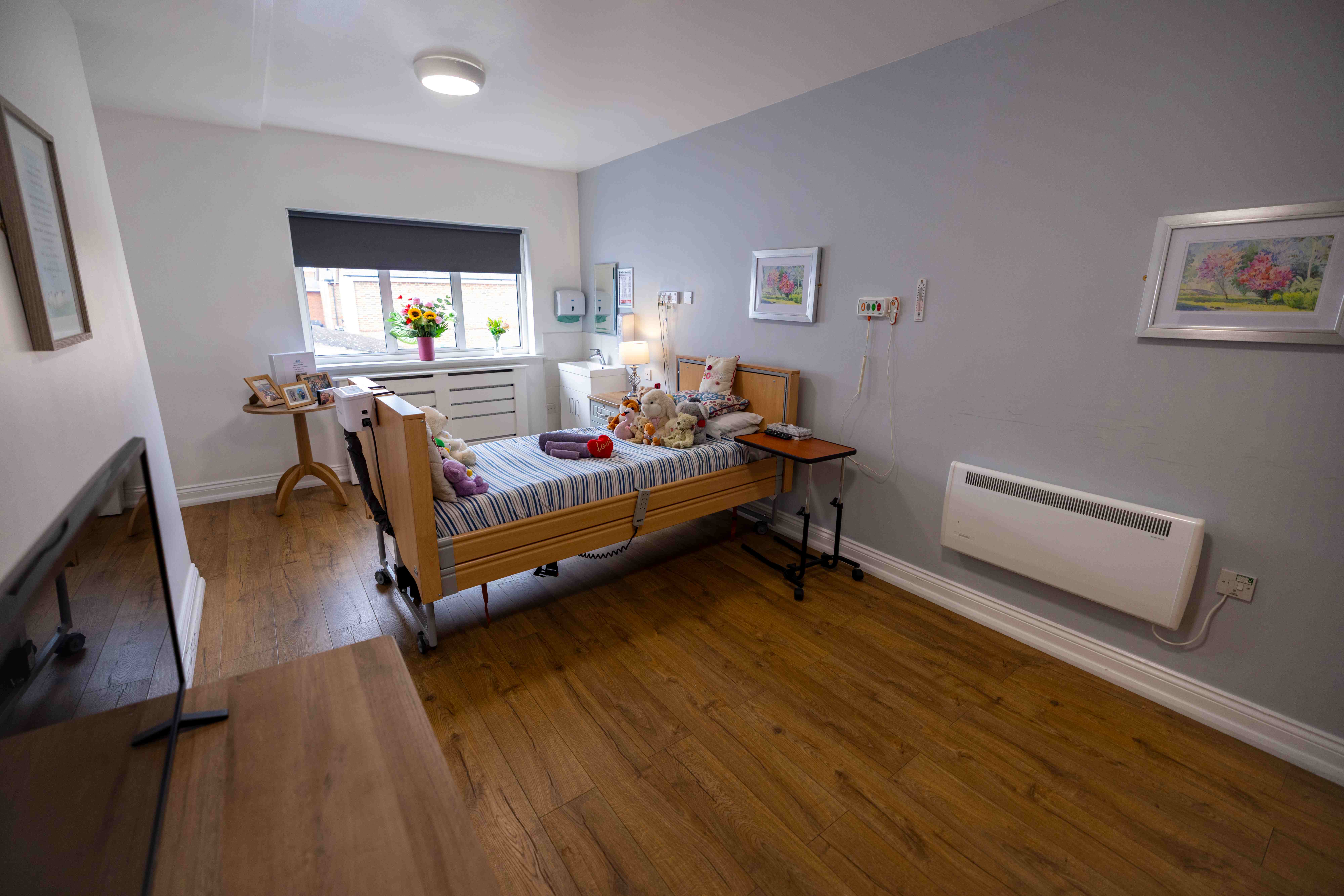 Spacious bedroom with artwork and natural light