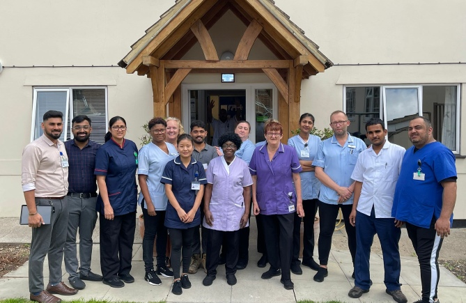Image of the staff at Braintree Nursing Home standing outside front of property